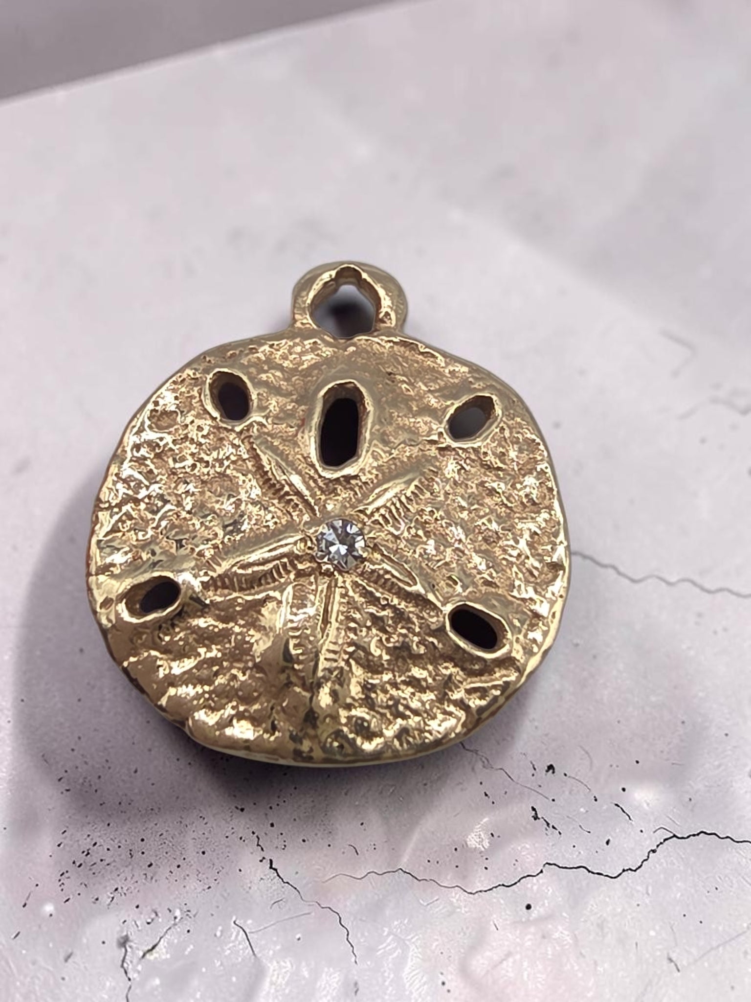 James Avery solid 14K yellow gold sand dollar charm with a custom set diamond in the center