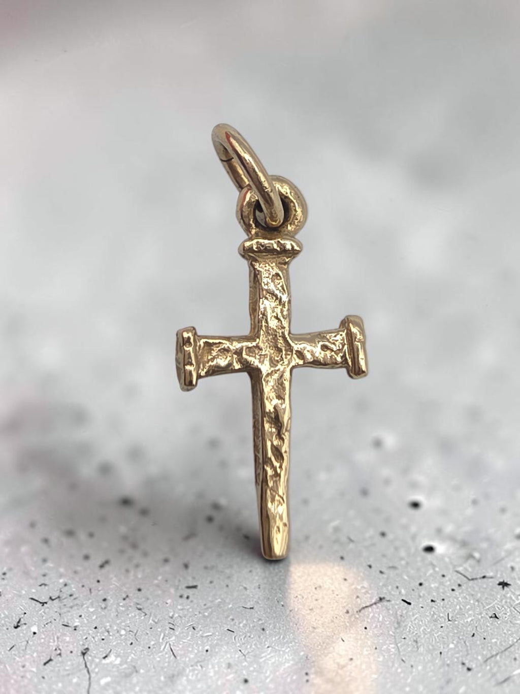 Retired James Avery solid 14K yellow gold nail cross charm with hammered texture and uncut loop