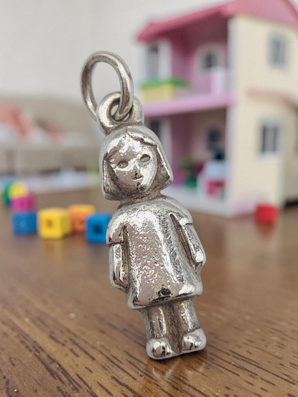 Retired James Avery sterling silver little girl charm with box and pouch shown from the front
