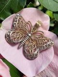 Solid 10K two tone gold filigree butterfly pendant with openwork scrollwork wings
