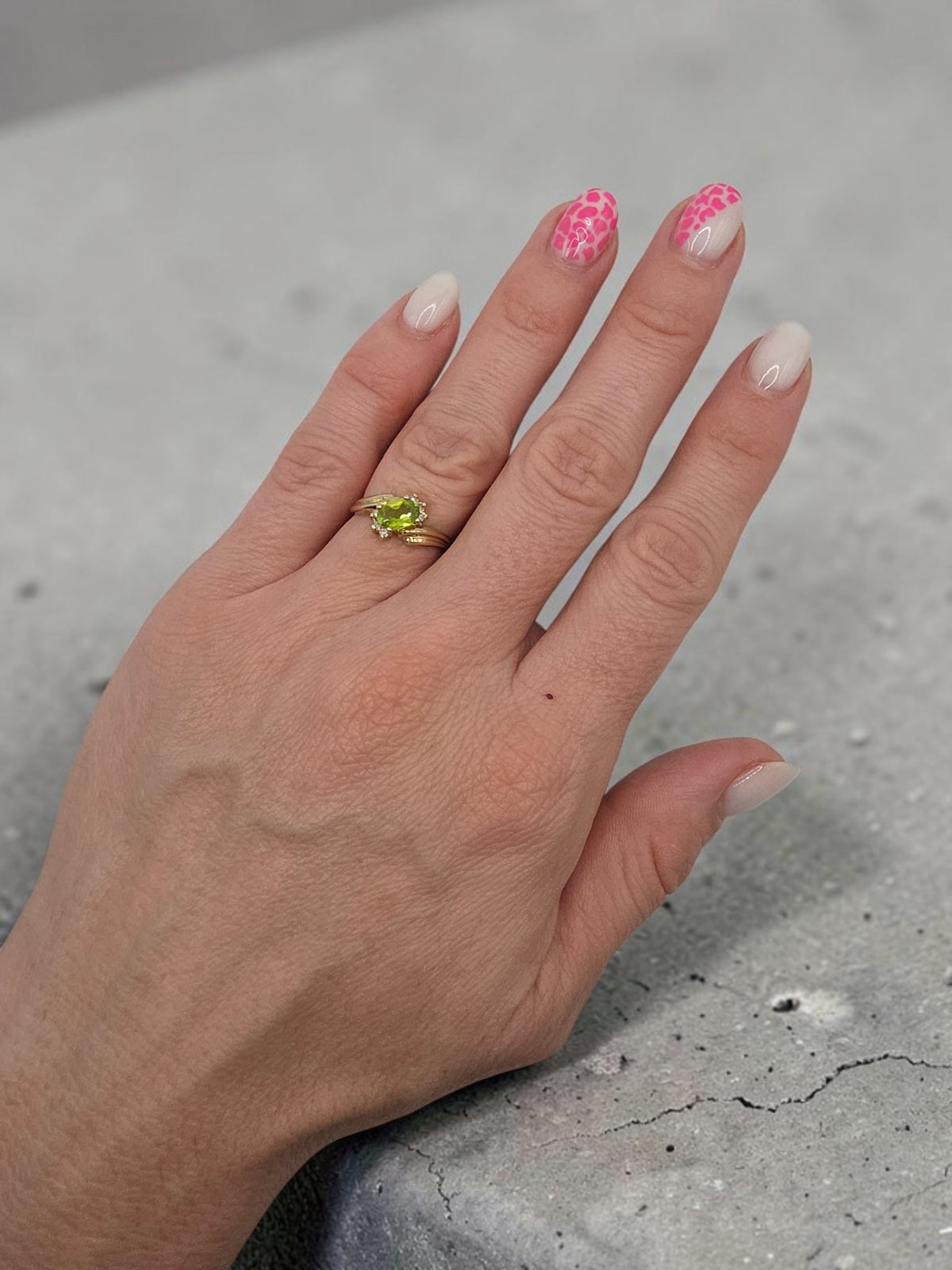 Solid 14K Yellow Gold Ring with Oval Cut Green Peridot Flanked by Arcs of Round Diamond Accents on Grooved Swept Shoulders on Finger