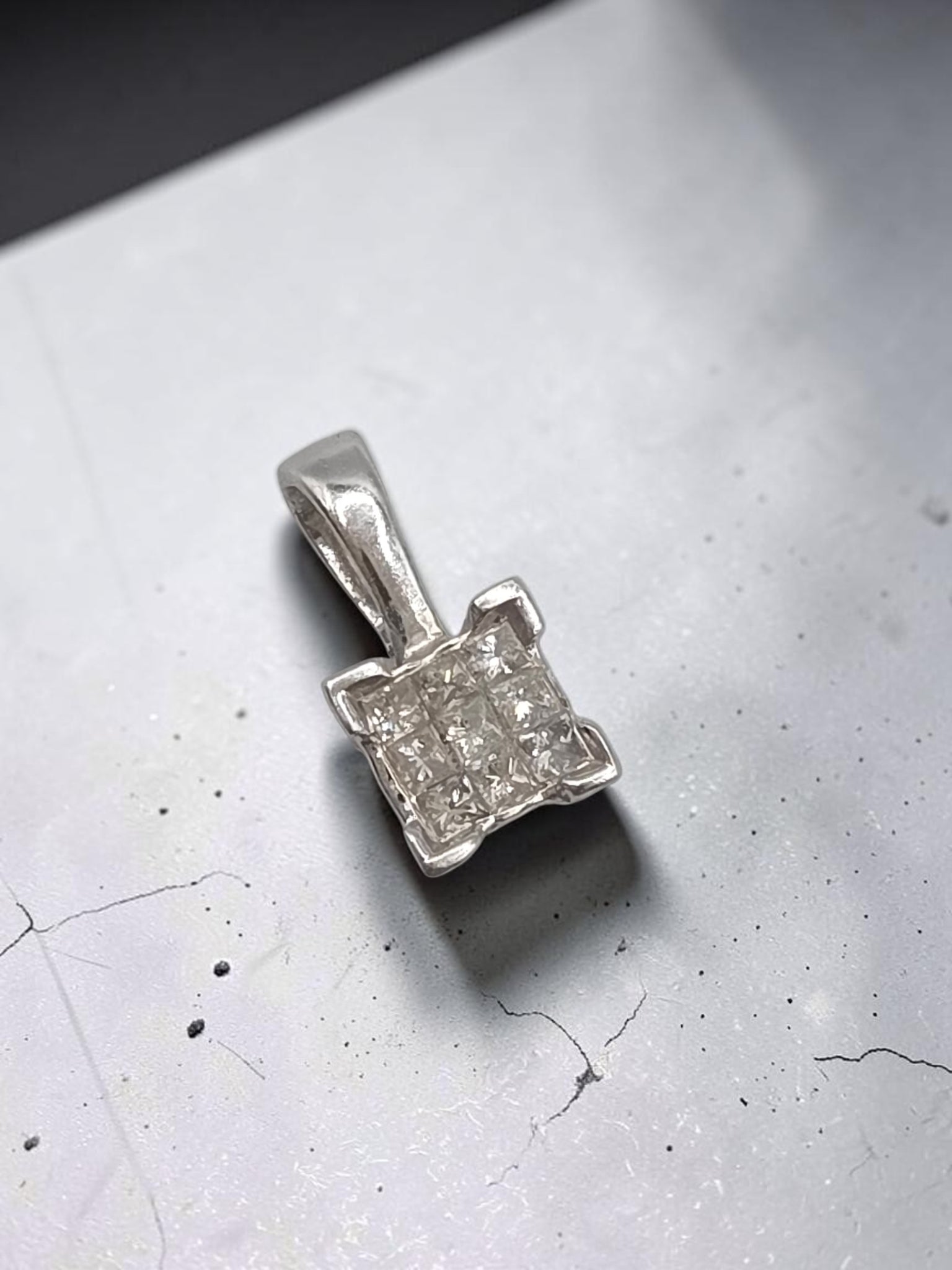 Solid 14K white gold diamond square cluster pendant marked WGD with nine square cut diamonds