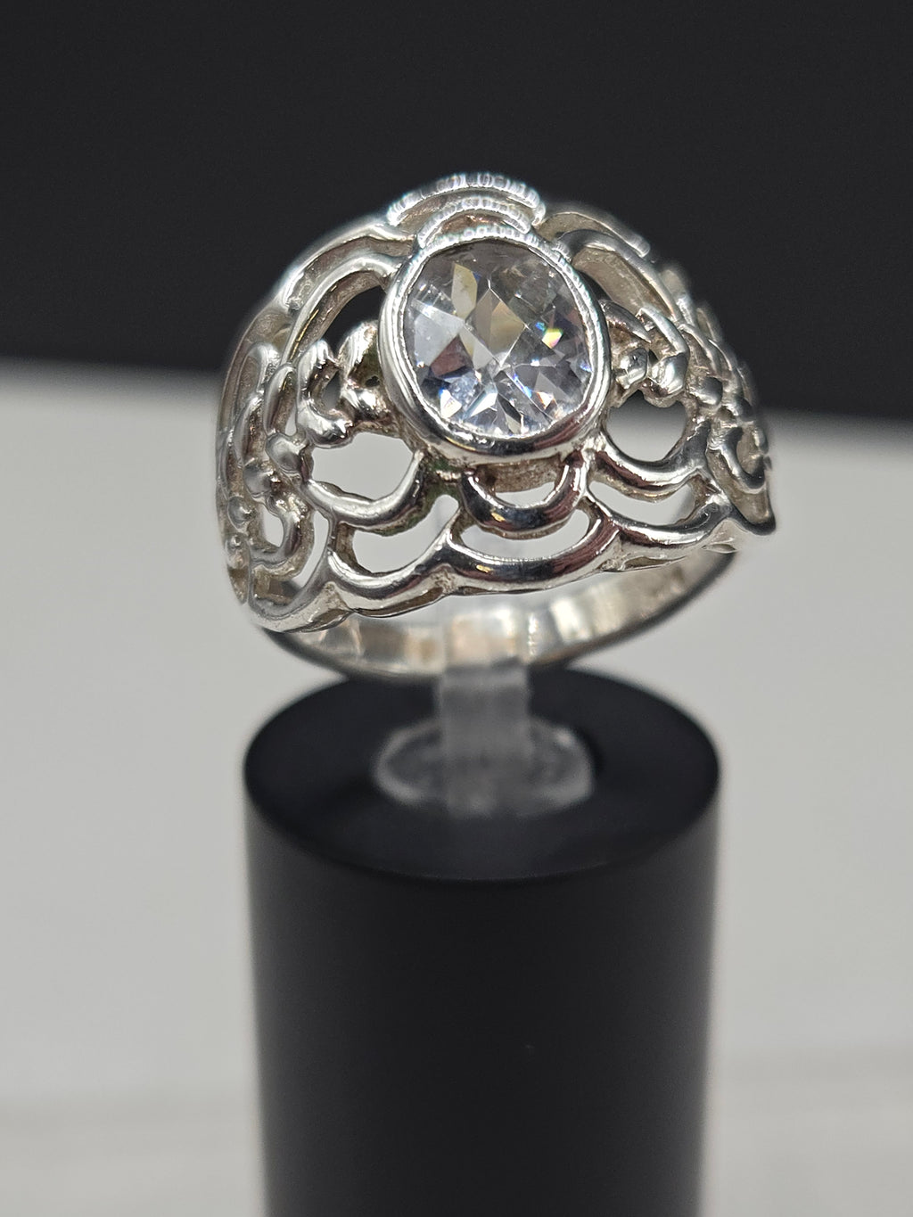 Sterling Silver Wide Band Ring with Oval Cubic Zirconia in Bezel Setting on Filigree Openwork Dome