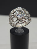Sterling Silver Wide Band Ring with Oval Cubic Zirconia in Bezel Setting on Filigree Openwork Dome