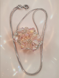 Sterling silver Italian snake chain necklace with pink faceted bead cluster pendant
