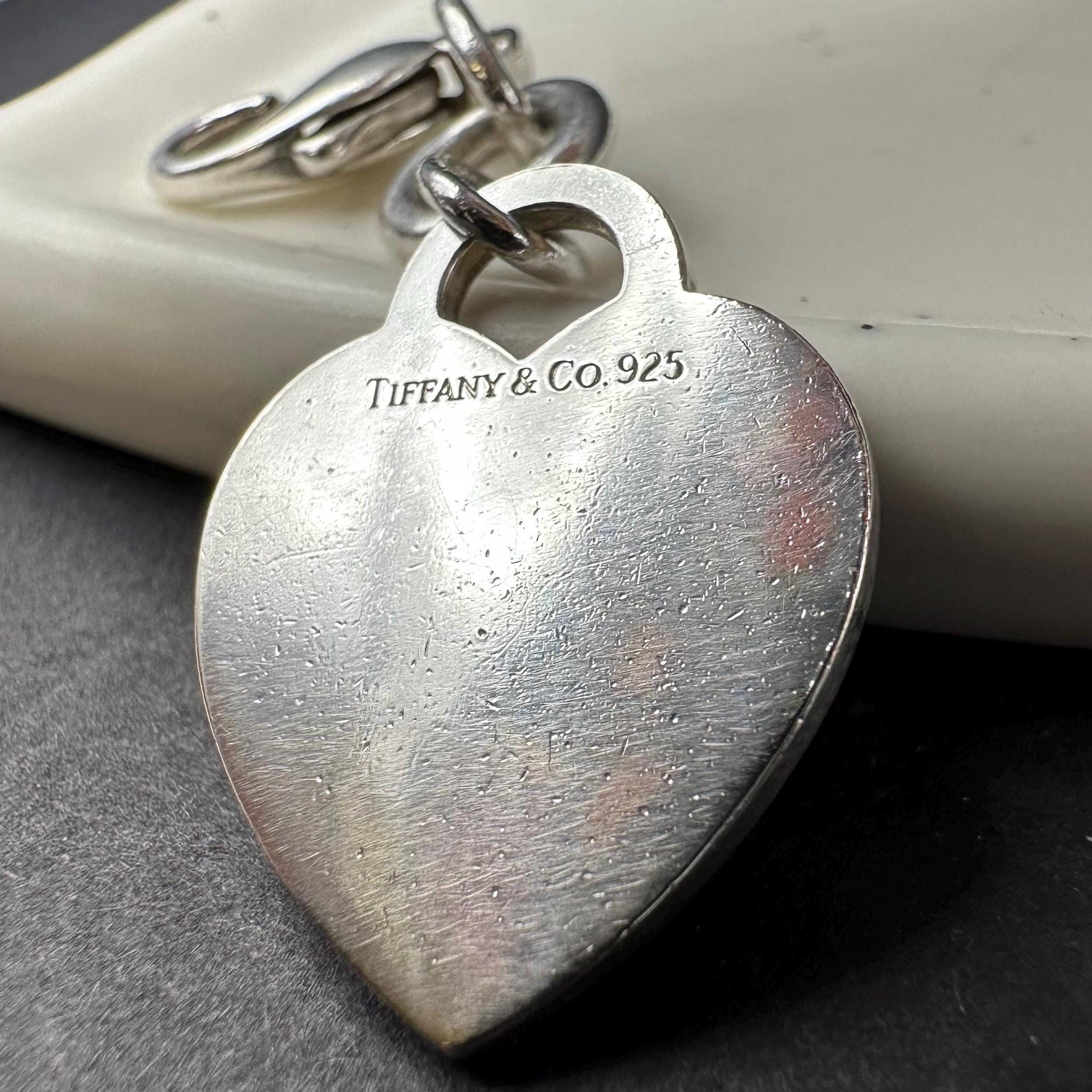 Tiffany & Co sterling silver plain polished heart charm pendant with lobster clasp, marked 925