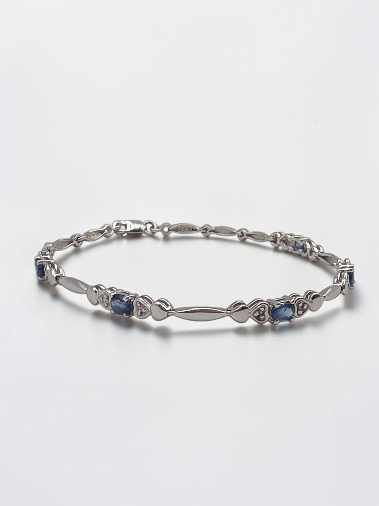 Vintage Sadye L Vassil solid 10K gold blue sapphire and diamond link bracelet with heart stations