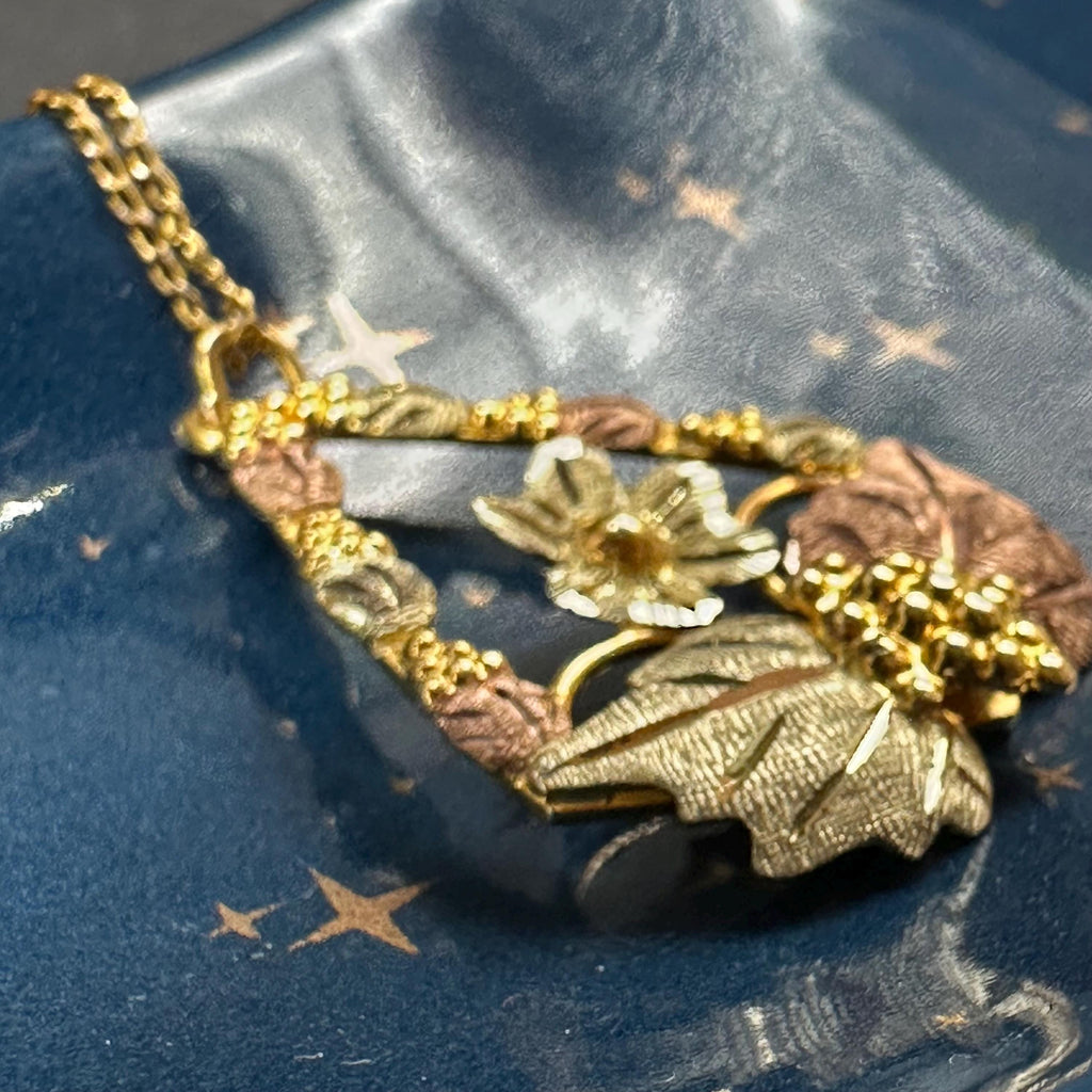 Black Hills Solid 10K Gold Pendant with Solid 12K Leaf Accents – 18 Inch Chain