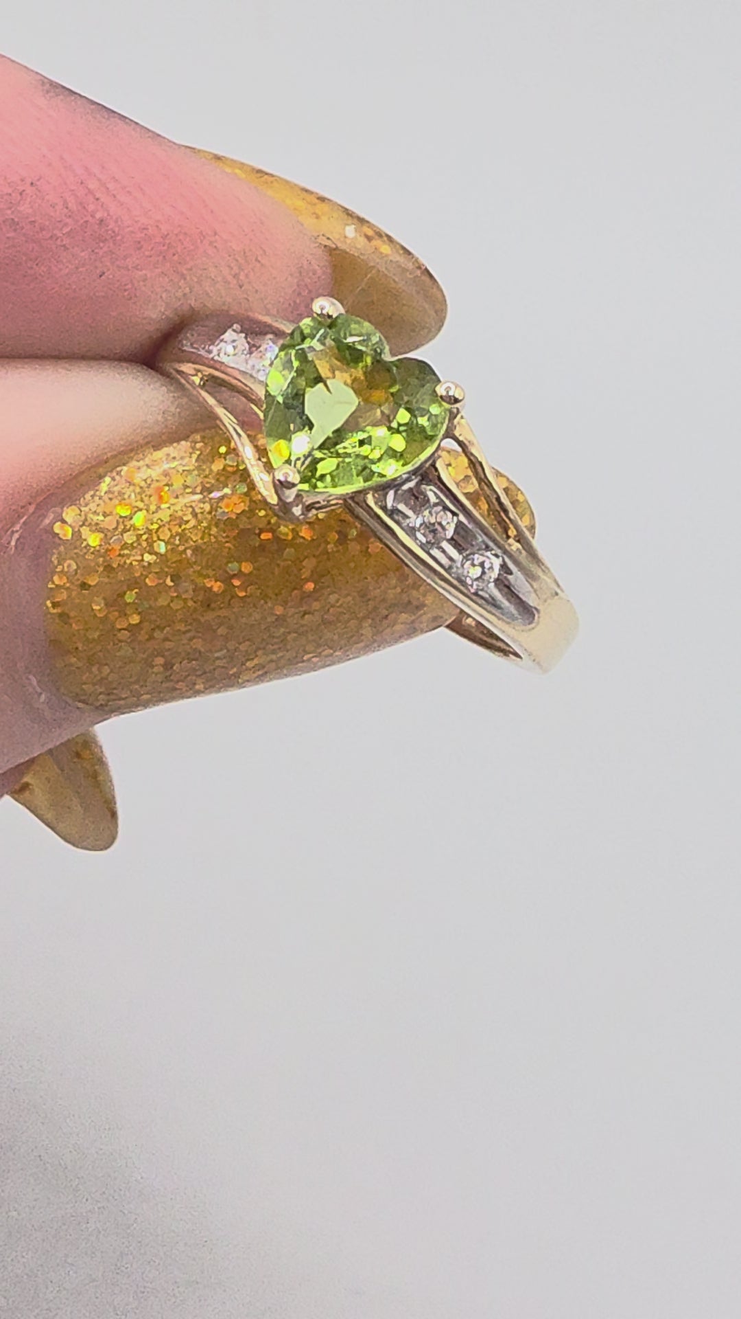 Solid 10K Yellow Gold Split Shank Ring with Heart Cut Green Peridot Center Stone and Channel Set CZ Accents Video