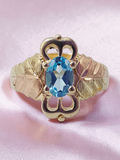 Black Hills Gold Solid 10K Ring with Oval-Cut Blue Topaz – Size 4.75