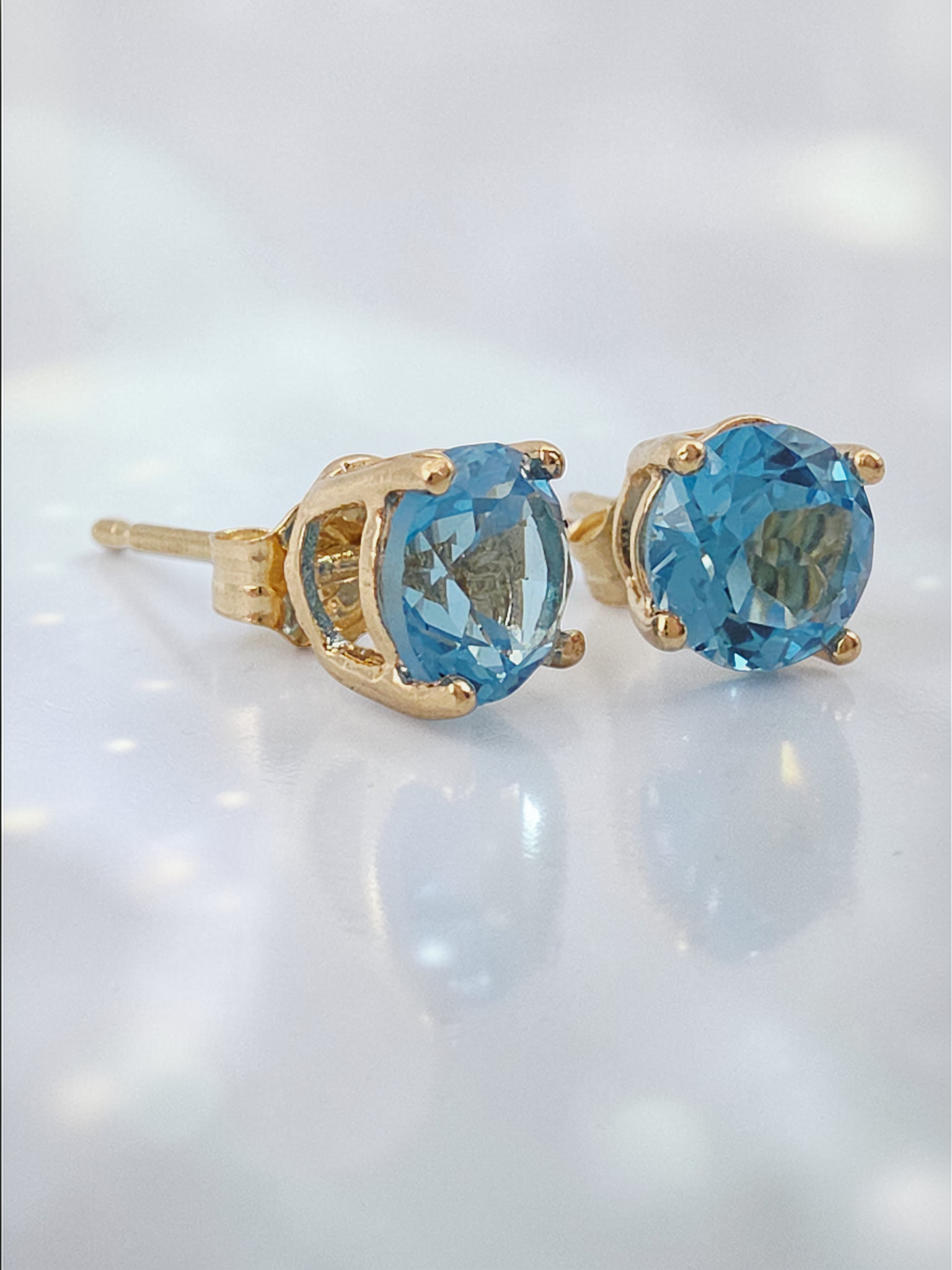 Solid 14K Yellow Gold Stud Earrings with Round-Cut Blue Topaz