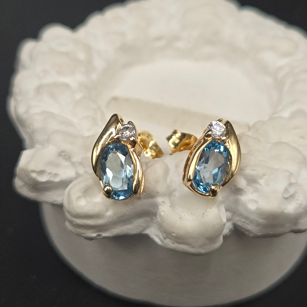 Solid 10K Yellow Gold Stud Earrings with Pear Cut Blue Topaz