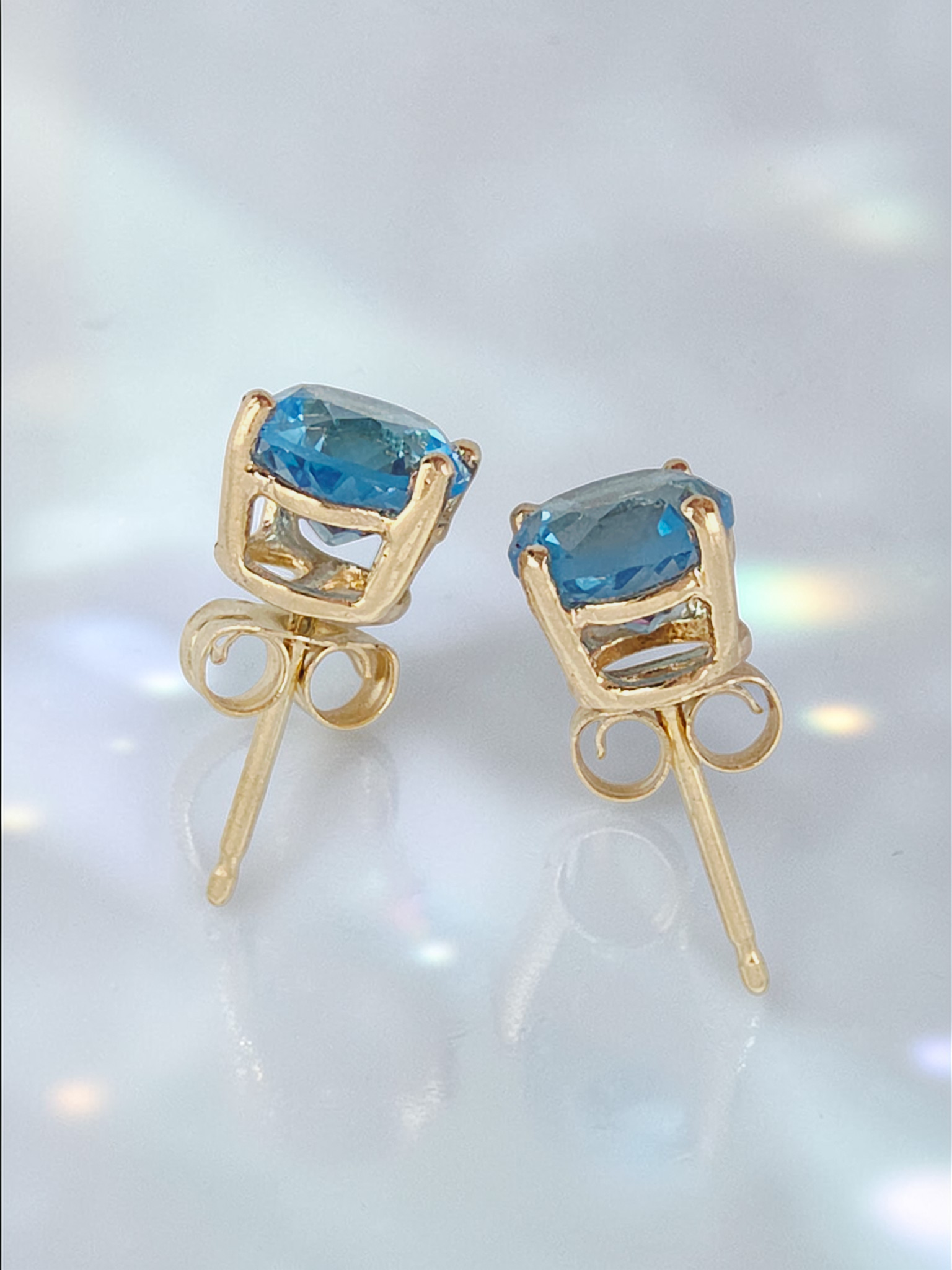 Solid 14K Yellow Gold Stud Earrings with Round-Cut Blue Topaz