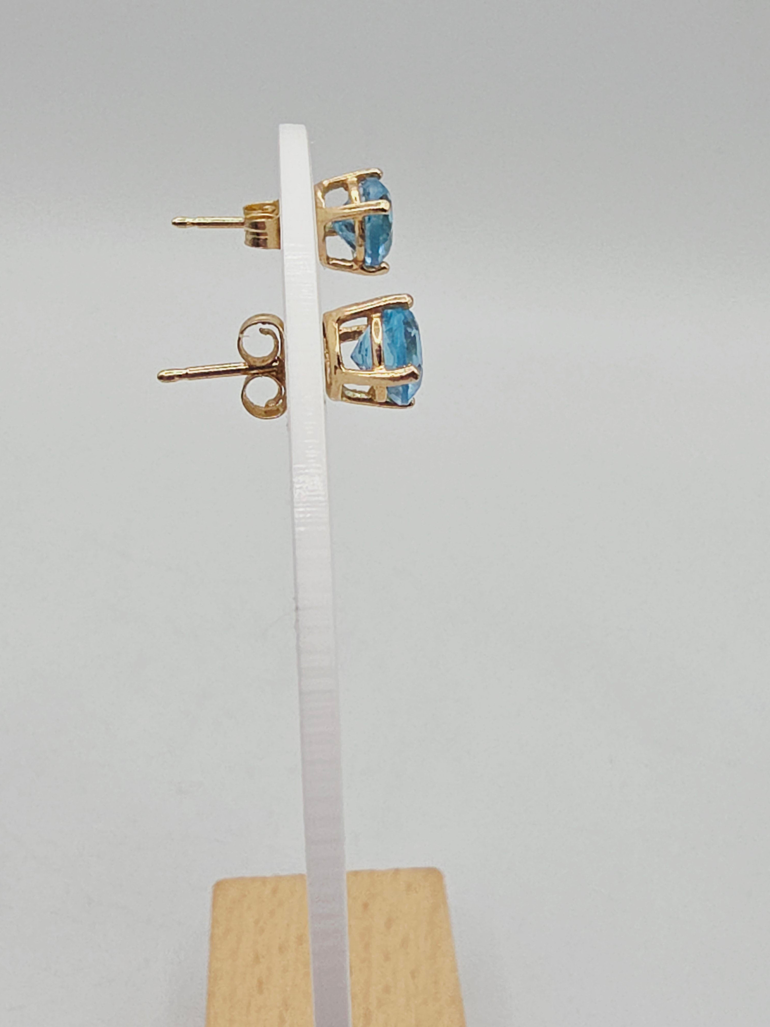 Solid 14K Yellow Gold Stud Earrings with Round-Cut Blue Topaz